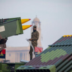 An Indian soldier stands atop an Army combat vehicle during a rehearsal for the upcoming Republic Day parade in New Delhi, India, January 20, 2025. REUTERS/Adnan Abidi