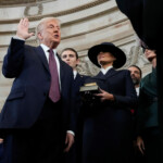 Donald Trump is sworn in as the 47th president of the United States by Chief Justice John Roberts as Melania Trump holds the Bible during the 60th Presidential Inauguration in the Rotunda of the U.S. Capitol in Washington, Monday, Jan. 20, 2025. Morry Gash/Pool via REUTERS
