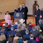 President Donald Trump speaks to the crowd in Emancipation Hall at the U.S. Capitol after being sworn in as the 47th president of the United State on Monday, January 20, 2025 in Washington, DC. Behind him is Vice-President JD Vance and to his right is House Speaker Mike Johnson. BONNIE CASH/Pool via REUTERS