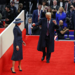U.S. President Donald Trump dances as he and first lady Melania Trump arrive at Capital One arena on the inauguration day of Trump's second presidential term, in Washington, U.S., January 20, 2025. REUTERS/Brian Snyder