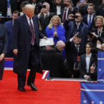U.S. President Donald Trump and first lady Melania Trump arrive at Capital One arena on the inauguration day of Trump's second presidential term, in Washington, U.S., January 20, 2025. REUTERS/Brian Snyder