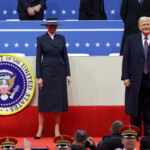 U.S. President Donald Trump and first lady Melania Trump attend a rally on the inauguration day of his second Presidential term, inside Capital One, in Washington, U.S. January 20, 2025. REUTERS/Mike Segar