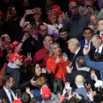 U.S. President Donald Trump greets supporters during a rally on the inauguration day of his second Presidential term, inside Capital One, in Washington, U.S. January 20, 2025. REUTERS/Mike Segar