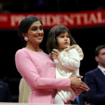 Second lady Usha Vance holds her daughter Mirabel while attending the inaugural parade inside Capital One Arena on the inauguration day of U.S. President Donald Trump's second presidential term, in Washington, U.S. January 20, 2025. REUTERS/Carlos Barria