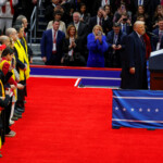 U.S. President Donald Trump speaks next to relatives of hostages from the deadly October 7, 2023 attack by Hamas, at Capital One Arena on the inauguration day of Donald Trump's second presidential term, in Washington, U.S. January 20, 2025. REUTERS/Brian Snyder