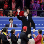 Barron Trump waves during a rally on the inauguration day of U.S. President Donald Trump's second Presidential term, inside Capital One, in Washington, U.S. January 20, 2025. REUTERS/Mike Segar