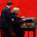 U.S. President Donald Trump prepares to sign executive orders on the inauguration day of Trump's second Presidential term, inside Capital One Arena, in Washington, U.S. January 20, 2025. REUTERS/Brian Snyder