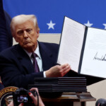 U.S. President Donald Trump shows his signature on an executive order that he signed in front of supporters inside the Capital One Arena during ceremonies on the inauguration day of his second presidential term, in Washington, U.S. January 20, 2025. REUTERS/Amanda Perobelli