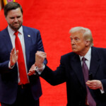 U.S. President Donald Trump throws a pen after he signed executive orders next to U.S. Vice President JD Vance on the inauguration day of Trump's second Presidential term, inside Capital One Arena, in Washington, U.S. January 20, 2025. REUTERS/Brian Snyder