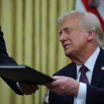 U.S. President Donald Trump reacts on the day he signs documents as he issues executive orders and pardons for January 6 defendants in the Oval Office at the White House on Inauguration Day in Washington, U.S., January 20, 2025. REUTERS/Carlos Barria