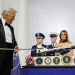 U.S. President Donald Trump cuts a cake with a sword during the Commander in Chief Ball in honor of the inauguration of U.S. President Donald Trump in Washington, U.S., January 20, 2025. REUTERS/Carlos Barria