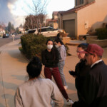 Gabriel Lopez and his family stand as they evacuate their home as the Hughes Fire burns in Castaic, California, U.S. January 22, 2025. REUTERS/Joel Angel Juarez
