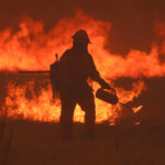 A crew battles the fire as the Hughes Fire burns in Castaic Lake, California, U.S. January 22, 2025. REUTERS/David Swanson