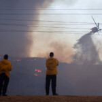 Firefighters and aircraft battle the Hughes Fire near Castaic Lake, north of Santa Clarita, California, U.S. January 22, 2025. REUTERS/Ringo Chiu