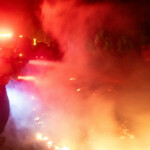 A firefighter battles the Hughes Fire near Castaic Lake, north of Santa Clarita, California, U.S. January 22, 2025. REUTERS/Ringo Chiu