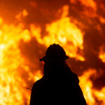 A firefighter battles the Hughes Fire near Castaic Lake, north of Santa Clarita, California, U.S. January 22, 2025. REUTERS/Ringo Chiu
