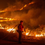 A firefighter battles the Hughes Fire near Castaic Lake, north of Santa Clarita, California, U.S. January 22, 2025. REUTERS/Ringo Chiu Hughes Fire Los Angeles