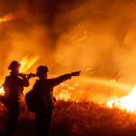 Firefighters battle the Hughes Fire near Castaic Lake, north of Santa Clarita, California, U.S. January 22, 2025. REUTERS/Ringo Chiu