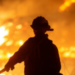 A firefighter battles the Hughes Fire near Castaic Lake, north of Santa Clarita, California, U.S. January 22, 2025. REUTERS/Ringo Chiu