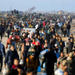 Palestinians, who were displaced to the south at Israel's order during the war, arrive on foot while making their way back to their homes in the northern Gaza, amid a ceasefire between Israel and Hamas, in Gaza City, January 27, 2025. REUTERS/Dawoud Abu Alkas