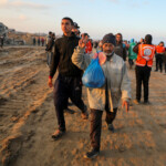 A Palestinian man, who was displaced to the south at Israel's order during the war, gestures as he arrives on foot while making his way back to his home in the northern Gaza, amid a ceasefire between Israel and Hamas, in Gaza City, January 27, 2025. REUTERS/Dawoud Abu Alkas
