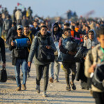 Palestinians, who were displaced to the south at Israel's order during the war, arrive on foot while making their way back to their homes in the northern Gaza, amid a ceasefire between Israel and Hamas, in Gaza City, January 27, 2025. REUTERS/Dawoud Abu Alkas