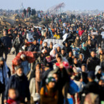 Palestinians, who were displaced to the south at Israel's order during the war, arrive on foot while making their way back to their homes in the northern Gaza, amid a ceasefire between Israel and Hamas, in Gaza City, January 27, 2025. REUTERS/Dawoud Abu Alkas