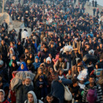 Palestinians, who were displaced to the south at Israel's order during the war, make their way back to their homes in northern Gaza, amid a ceasefire between Israel and Hamas, in the central Gaza Strip, January 27, 2025. REUTERS/Ramadan Abed