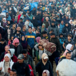 Palestinians, who were displaced to the south at Israel's order during the war, make their way back to their homes in northern Gaza, amid a ceasefire between Israel and Hamas, in the central Gaza Strip, January 27, 2025. REUTERS/Ramadan Abed