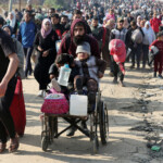 Palestinians, who were displaced to the south at Israel's order during the war, make their way back to their homes in northern Gaza, amid a ceasefire between Israel and Hamas, in the central Gaza Strip, January 27, 2025. REUTERS/Ramadan Abed