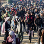 Palestinians, who were displaced to the south at Israel's order during the war, make their way back to their homes in northern Gaza, amid a ceasefire between Israel and Hamas, in the central Gaza Strip, January 27, 2025. REUTERS/Ramadan Abed