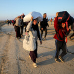 Palestinians, who were displaced to the south at Israel's order during the war, make their way on foot as they return to their homes in the northern Gaza, amid a ceasefire between Israel and Hamas, in Gaza City, January 27, 2025. REUTERS/Dawoud Abu Alkas