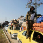 Palestinians, who were displaced to the south at Israel's order during the war, wait to head back to their homes in northern Gaza by vehicle through Salahudeen Road, amid a ceasefire between Israel and Hamas, in the central Gaza Strip, January 27, 2025. REUTERS/Hatem Khaled