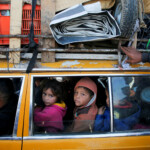 Palestinians, who were displaced to the south at Israel's order during the war, wait to head back to their homes in northern Gaza by vehicle through Salahudeen Road, amid a ceasefire between Israel and Hamas, in the central Gaza Strip, January 27, 2025. REUTERS/Hatem Khaled