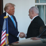U.S President Donald Trump and Israeli Prime Minister Benjamin Netanyahu shake hands at the entrance of the White House in Washington, U.S., February 4, 2025. REUTERS/Leah Millis
