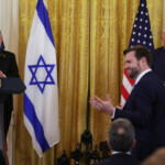 U.S. Vice President JD Vance stands as U.S. President Donald Trump and Israeli Prime Minister Benjamin Netanyahu hold a joint press conference in the East Room at the White House in Washington, U.S., February 4, 2025. REUTERS/Leah Millis