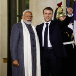 French President Emmanuel Macron welcomes Indian Prime Minister Narendra Modi, on the day of a meeting with international investors in IA at the Elysee Palace as part of the Artificial Intelligence (AI) Action Summit in Paris, France, February 10, 2025. REUTERS/Gonzalo Fuentes