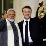 French President Emmanuel Macron and Indian Prime Minister Narendra Modi gesture, on the day of a meeting with international investors in IA at the Elysee Palace as part of the Artificial Intelligence (AI) Action Summit in Paris, France, February 10, 2025. REUTERS/Gonzalo Fuentes
