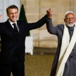 French President Emmanuel Macron and Indian Prime Minister Narendra Modi hold hands on the day of a meeting with international investors in IA at the Elysee Palace as part of the Artificial Intelligence (AI) Action Summit in Paris, France, February 10, 2025. REUTERS/Gonzalo Fuentes