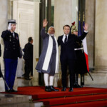 French President Emmanuel Macron and Indian Prime Minister Narendra Modi gesture, on the day of a meeting with international investors in IA at the Elysee Palace as part of the Artificial Intelligence (AI) Action Summit in Paris, France, February 10, 2025. REUTERS/Gonzalo Fuentes