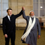 French President Emmanuel Macron and Indian Prime Minister Narendra Modi hold hands on the day of a meeting with international investors in IA at the Elysee Palace as part of the Artificial Intelligence (AI) Action Summit in Paris, France, February 10, 2025. REUTERS/Gonzalo Fuentes