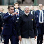 French President Emmanuel Macron and Indian Prime Minister Narendra Modi arrive to attend the Artificial Intelligence (AI) Action Summit at the Grand Palais in Paris, France, February 11, 2025. REUTERS/Benoit Tessier