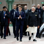 French President Emmanuel Macron and Indian Prime Minister Narendra Modi arrive to attend the Artificial Intelligence (AI) Action Summit at the Grand Palais in Paris, France, February 11, 2025. REUTERS/Benoit Tessier