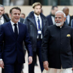 French President Emmanuel Macron and Indian Prime Minister Narendra Modi arrive to attend the Artificial Intelligence (AI) Action Summit at the Grand Palais in Paris, France, February 11, 2025. REUTERS/Benoit Tessier