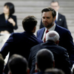 U.S. Vice President JD Vance greets French President Emmanuel Macron and Indian Prime Minister Narendra Modi after delivering a speech during the plenary session of the Artificial Intelligence (AI) Action Summit at the Grand Palais in Paris, France, February 11, 2025. REUTERS/Benoit Tessier