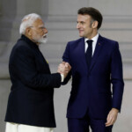 French President Emmanuel Macron shakes hands with Indian Prime Minister Narendra Modi after their speeches to close the plenary session of the Artificial Intelligence (AI) Action Summit at the Grand Palais in Paris, France, February 11, 2025. REUTERS/Benoit Tessier