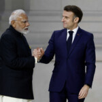 French President Emmanuel Macron shakes hands with Indian Prime Minister Narendra Modi after their speeches to close the plenary session of the Artificial Intelligence (AI) Action Summit at the Grand Palais in Paris, France, February 11, 2025. REUTERS/Benoit Tessier