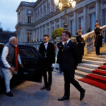 French President Emmanuel Macron welcomes Indian Prime Minister Narendra Modi as he arrives to attend the closing session of the Franco-Indian Economic Forum at the Quai d'Orsay following the Artificial Intelligence (AI) Action Summit in Paris, France, February 11, 2025. REUTERS/Abdul Saboor/Pool