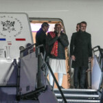Prime Minister Narendra Modi and French President Emanuel Macron arrive after the Artificial Intelligence Action Summit in Paris at Marseille Provence airport in Marignane, southern France, Feb. 11, 2025. Laurent Cipriani/Pool via REUTERS