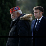 French President Emmanuel Macron and Indian Prime Minister Narendra Modi visit the Mazargues cemetery to remember Indian soldiers killed in World War One as part of a visit in Marseille, France, February 12, 2025. REUTERS/Christian Hartmann/Pool